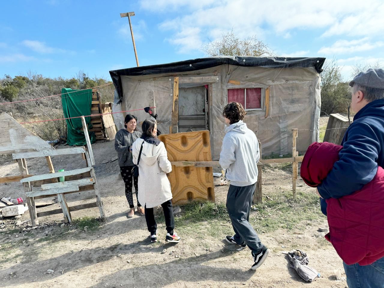 Volunteer helping a family in need in Acuña, Mexico